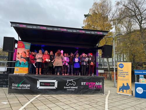 event island stevenage stage being used by a community choir